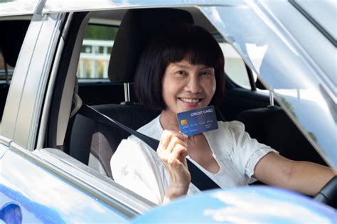 Jul 08, 2021 · if you get a new credit card with a 0% introductory balance transfer offer, you can usually avoid paying interest by paying off the debt you move over within the introductory period. Happy Asian Senior Woman Holding Payment Card Or Credit Card And Used To Pay For Gasoline ...
