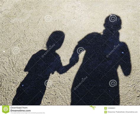 Shadow Of Father And Daughter On The Beach On The Beach