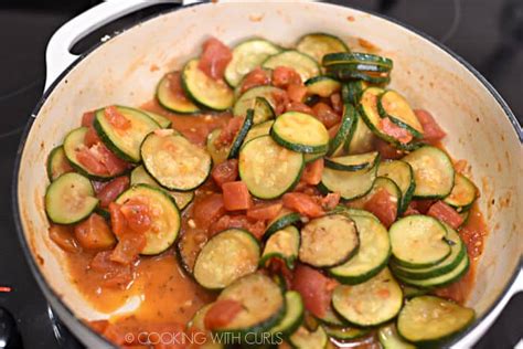 Sautéed Zucchini And Tomatoes Cooking With Curls