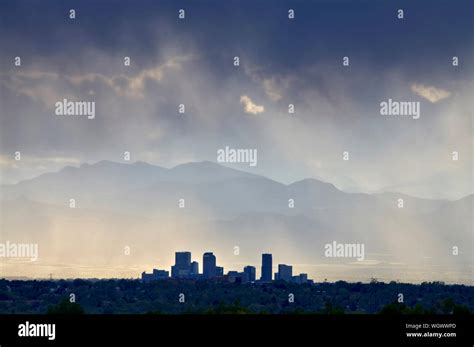 Denver Colorados Skyline Facing West With The Front Range Mountains In
