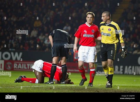 L R Charlton Athletics Richard Rufus Is Helped With His Injuries By Referee David Pugh Whilst