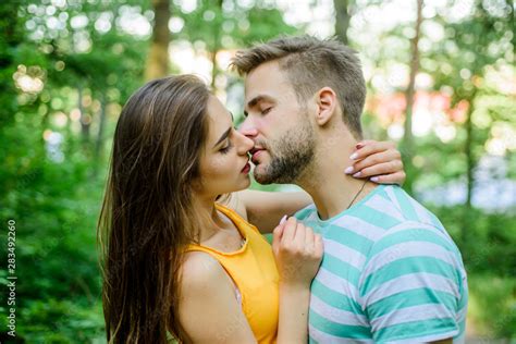 Couple In Love Kissing With Passion Outdoors Man And Woman Attractive Lovers Romantic Kiss
