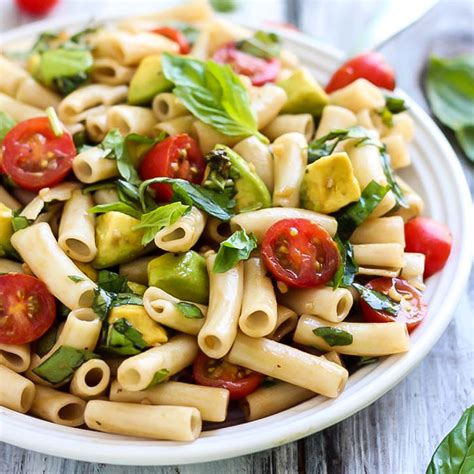 Cook pasta according to box directions, then allow it to cool and place in a large bowl. Vegan Avocado Caprese Pasta Salad - Emilie Eats