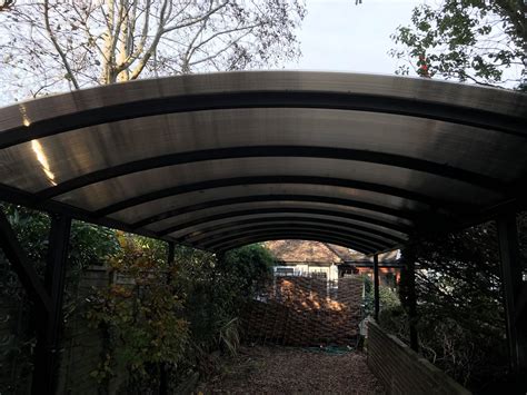 When a double carport just won't do, you can upgrade to a triple carport. A Long Double Carport Installed in Bognor Regis | Kappion Carports & Canopies