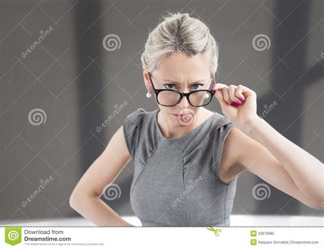 Strict Teacher Looking Through Glasses With Serious Expression Stock Image Image Of Female