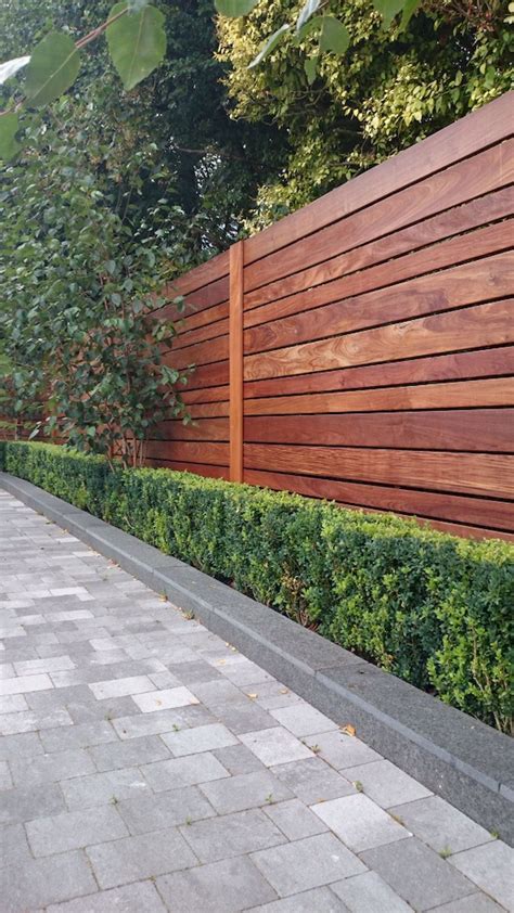 If you're looking to put a fence around your home or property. Stunning Privacy Fence Line Landscaping Ideas 28 - Rockindeco