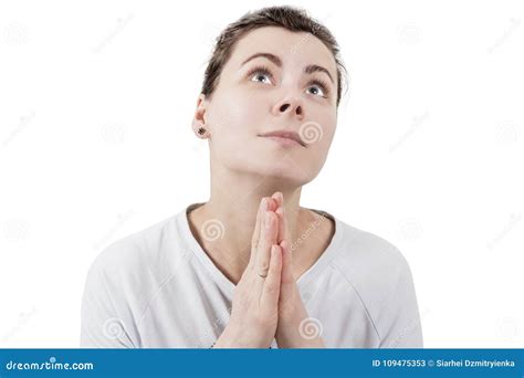 Young Brunette Woman Praying To God And Palms Together In Front Of Face