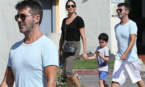 simon cowell displays slimmer physique during stroll with girlfriend lauren silverman and son