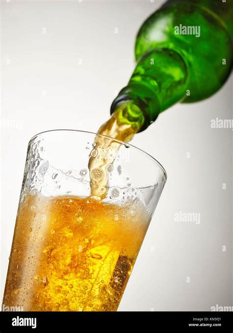 Beer Is Pouring Into Glass Stock Photo Alamy
