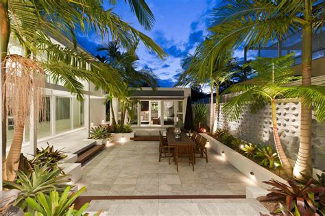 This small backyard features a small hot tub, which can make you feel more relaxed. Stunning sunken courtyard design for coastal oasis ...