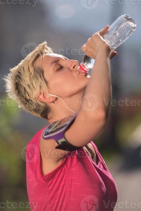 Woman Drinking Water After Jogging 11001188 Stock Photo At Vecteezy