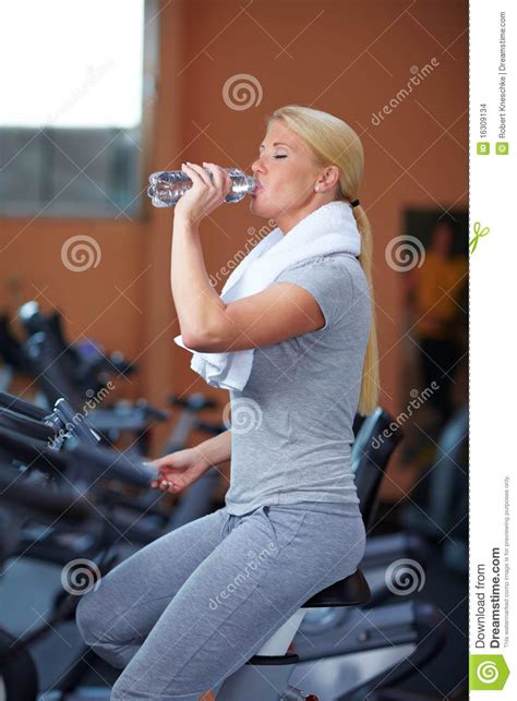 Woman Drinking Water On Hometrainer Stock Images Image