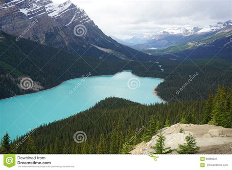 A Turquoise Lake Set Amongst The Mountains Stock Image Image Of