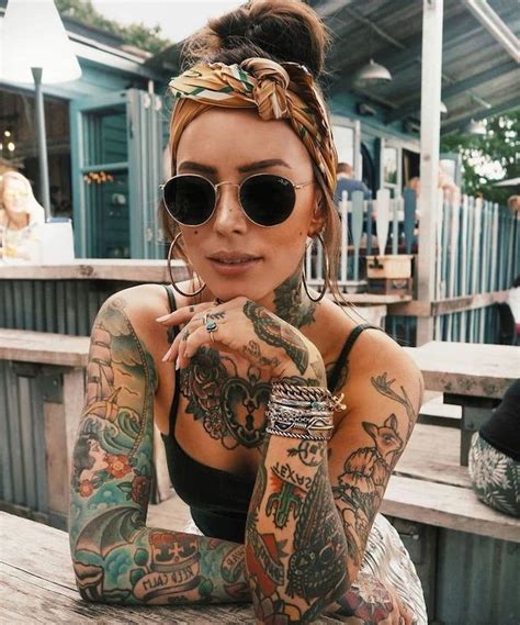 coloured half sleeve tattoo boat ocean waves beige bandana brown hair chest tattoo girl arm