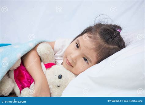 Cute Asian Little Child Girl Hugging Her Teddy Bear Stock Photo Image