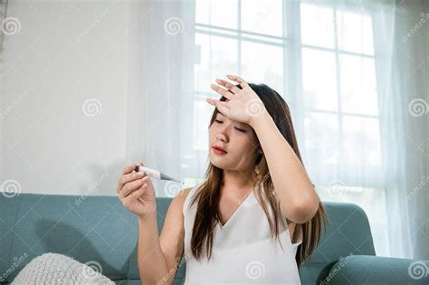 Sick Asian Young Woman Sit Under Blanket On Sofa She Sneeze Checking