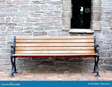 Bench On The Background Of A Stone Wall Stock Photo Image Of Chair