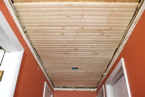 Beadboard, the most common type of wainscoting, is a row of narrow wood planks made up of beadboard paneling gives a room an intimate, traditional feel, making it ideal for homes with a. Beadboard Ceiling for the Downstairs Hallway - Blog ...