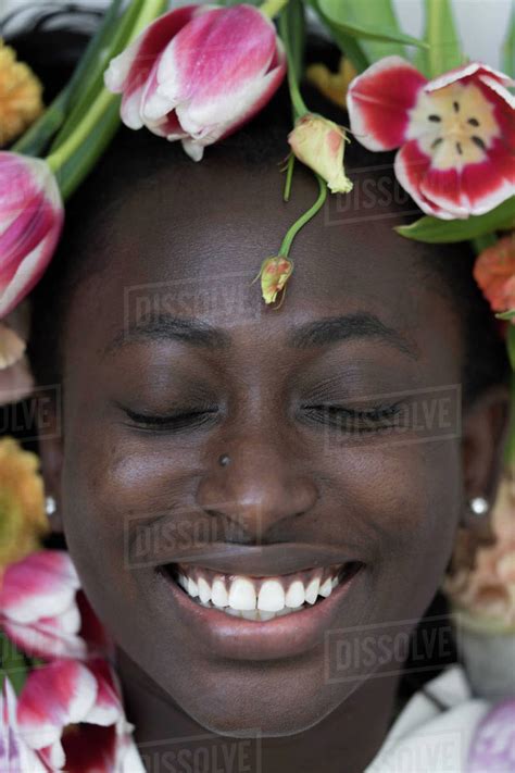 African Woman Face Surrounded By Flowers Stock Photo Dissolve