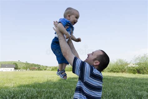 Man Holding A Baby Boy Stock Image Image Of Hugging 51449801