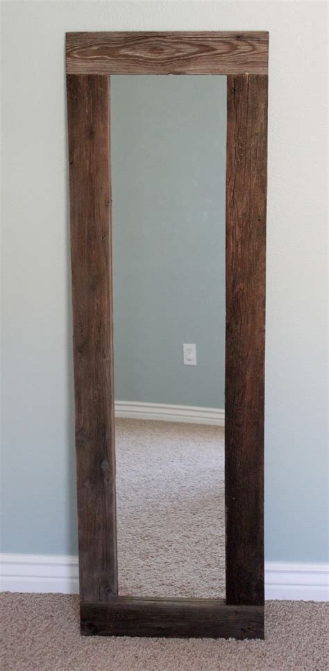The design of this mirror frame is quite interesting. creatively christy: DIY Reclaimed Wood Framed Mirror