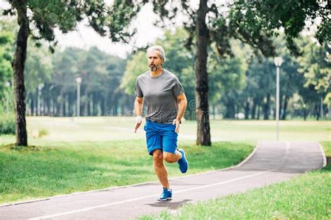 Senior Man Running Exercising Sport Fitness Active Fit Stock Photo