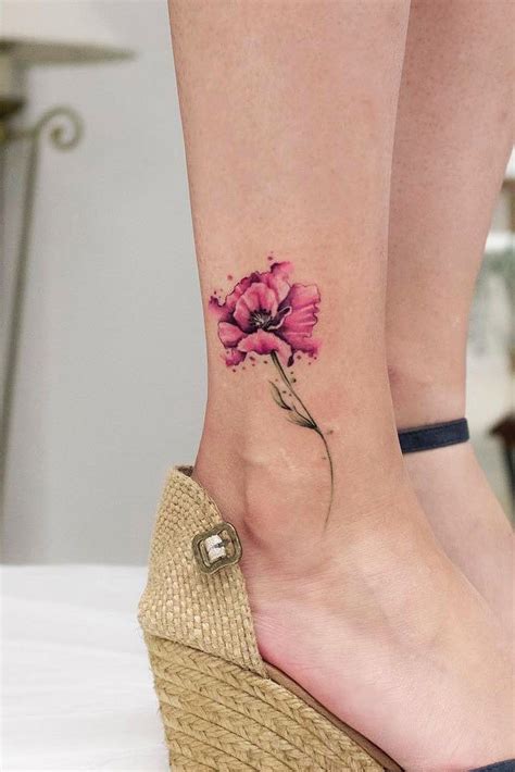 A triangle sits atop a flower in this tattoo. 51 Gorgeous Looking Watercolor Tattoo Ideas | Small ...