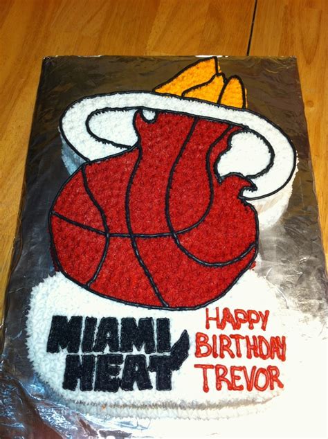 A Birthday Cake That Is Shaped Like A Basketball Ball With The Miami Heat On It
