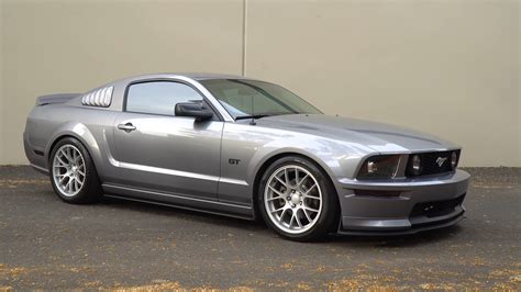 an early s197 ford mustang gt desperately tried to close the performance gap between itself and