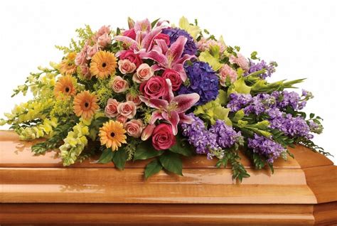 Casket sprays can combine as many flowers and motifs as the family wishes. Guide to Funeral Flowers in Australia • Gathered Here