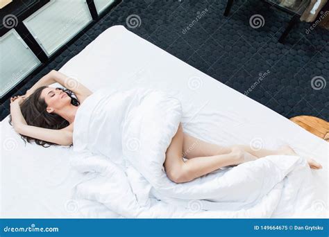From Above Beautiful Brunette Girl Laying On White Bed In Sensual Clothes Stock Image Image Of