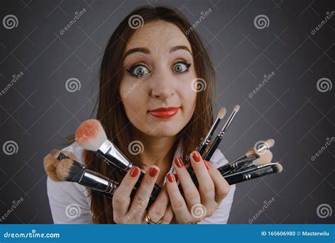 Woman Holding A Set Of Cosmetic Brushes For Make Up Stock Photo Image