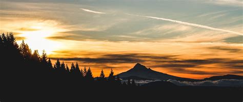 Download Wallpaper 2560x1080 Mountain Sunset Sky Clouds Trees