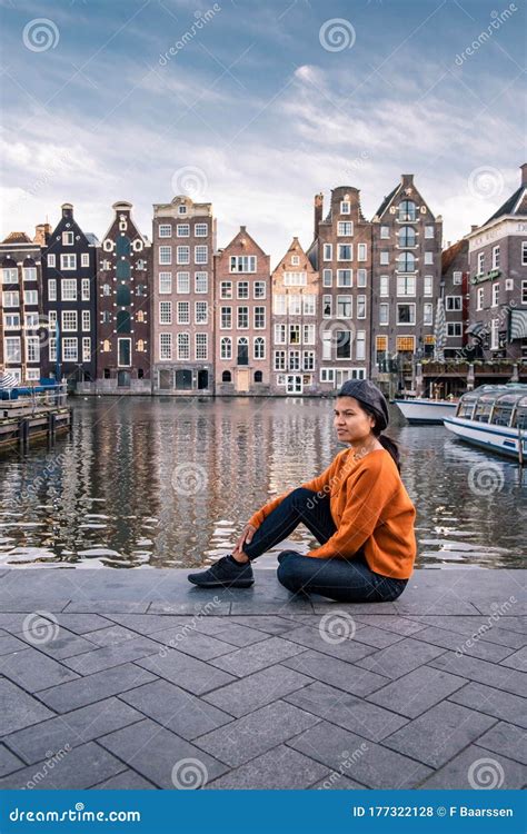 Amsterdam Damrak During Sunset Happy Woman On A Summer Evening At The