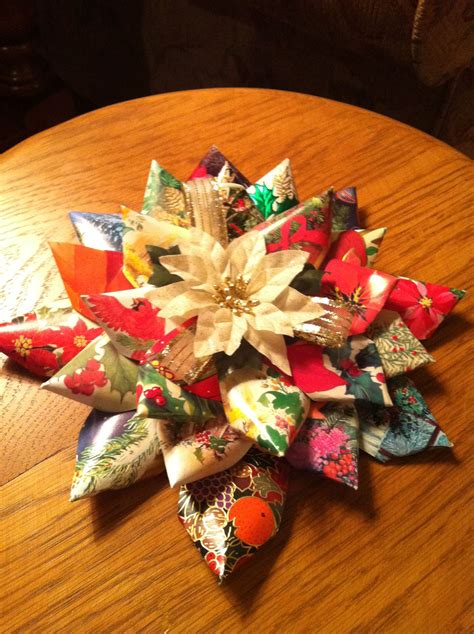 Christmas card collages also could be given as gifts to family and friends. Use old christmas cards to make an easy Christmas paper poinsettia | Christmas card ornaments