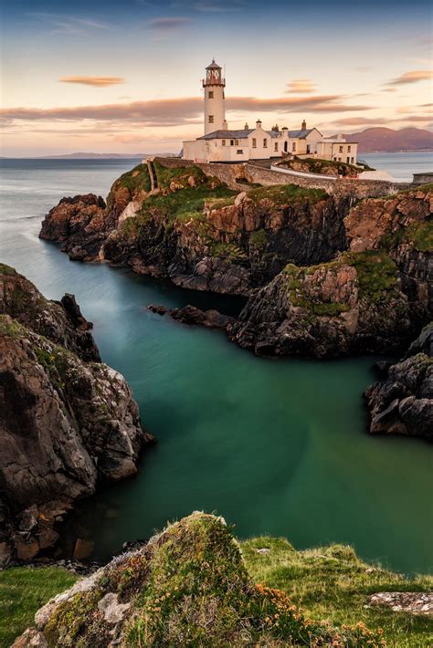 Fanad Head Lighthouse Stretches Bravely Into The Swirling Atlantic