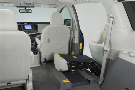 The access seat package in a toyota sienna allows a chair on an arm to exit the vehicle to allow people with decreased mobility to get into the vehicle. Toyota sienna auto access seat package