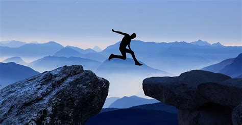 Hd Wallpaper Man Jump From Tip Of Mountain To Another Mountain Cliff