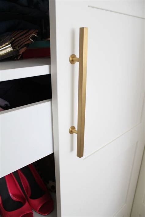 The big clothes rail holds about 25 shirts on hangers. making Ikea PAX look good - brushed gold handles by www ...