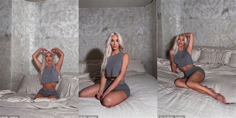 kim kardashian looks sensational as she strikes a series of sexy ab baring poses while lounging