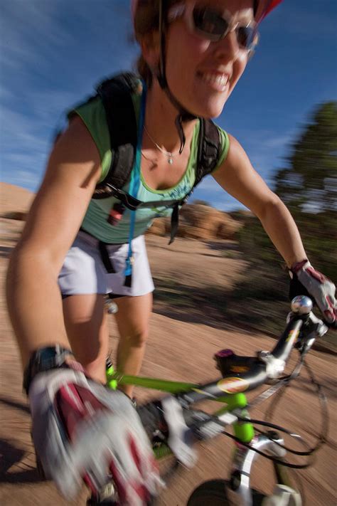 Woman Mountain Biking Moab Utah Photograph By Whit Richardson Fine