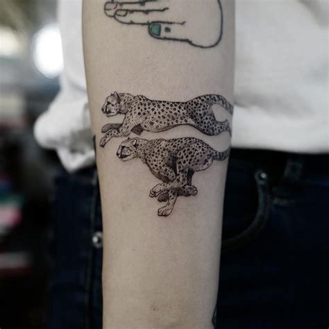 Two Cheetahs Tattooed On The Right Forearm Leopard Tattoos Tattoos