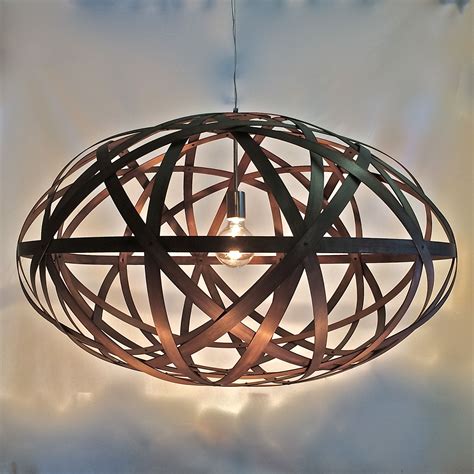 For a rustic country style, a glass and bronze pendant light or a pair of caged. Bali Ball - Timber Oval - Pendant Light