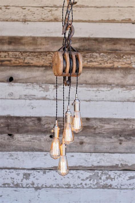 Pulley light pulley pendant light pendant lighting hanging lamp kitchen island lighting farmhouse industrial pendant light man cave lighting. The Cascade Chandelier Metal Barn Pulley pendant Light | Pulley pendant light, Rustic light ...