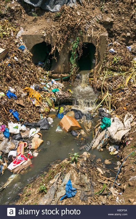 Ocean pollution in southeast asia countries. Drainage waste pipes empty water into the Ngong river ...