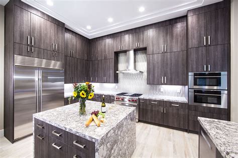 These Frameless Aspen Oak Cabinets Cover These Kitchen Walls With