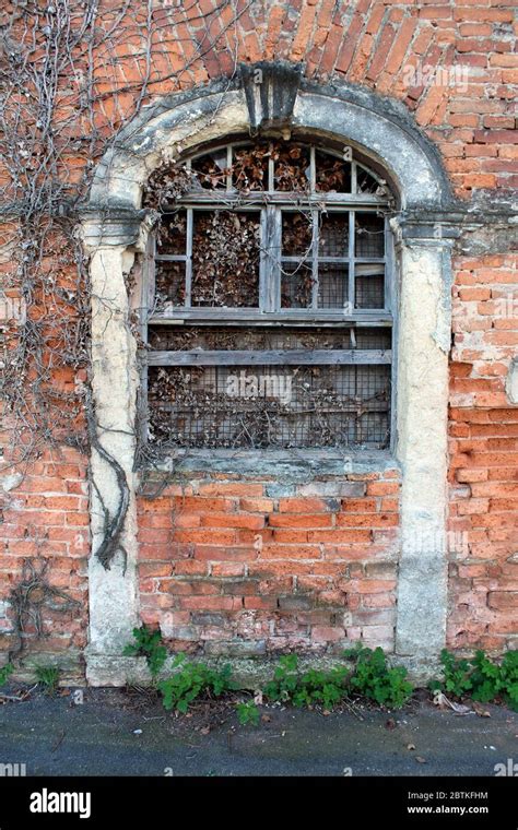 Closed And Boarded Creepy Looking Old Venetian Style Red Brick