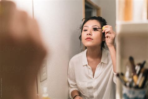 Attractive Japanese Woman Getting Ready Before Going Out By Stocksy