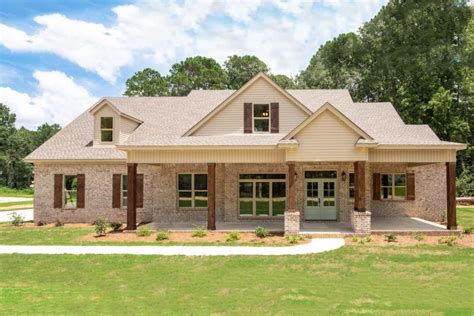 This Single Story Craftsman Home Plan Features A Traditional Brick