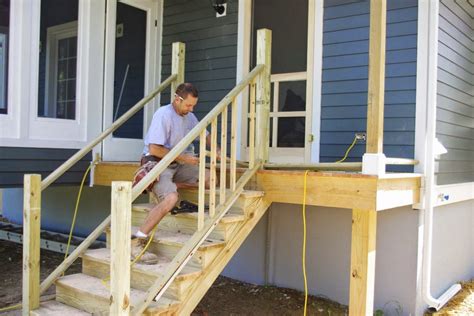 Standard deck railing height is between 36 and 42 inches, but be sure to check the code in your state before installing. The New House Next Door: Porch Stairs and Railings